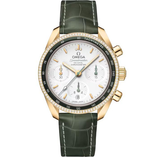 Omega Speedmaster 38 co-axial Chronometer Chronograph 38 mm, luxury men's watch with white dial, gold case, diamond accents on bezel, green leather strap, and chronograph sub-dials.