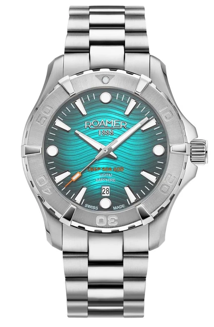 Roamer Watch, stainless steel diver's watch with turquoise wave-patterned dial, luminous hands and markers, date display, and rotating bezel.
