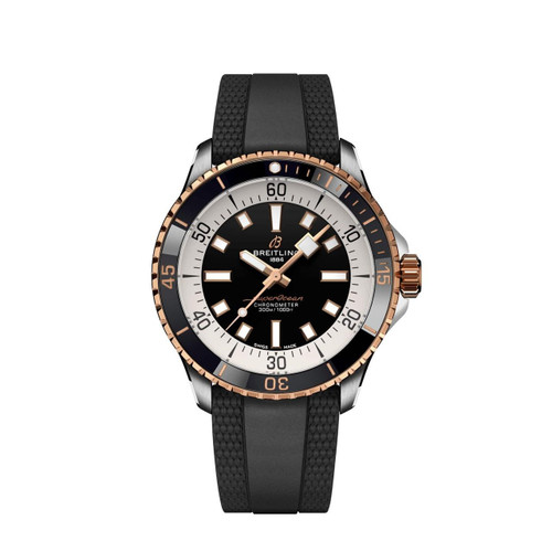 Breitling Superocean Automatic 42, luxury diver's watch with black dial, rose gold decorative elements, black rubber strap, and rotating bezel.