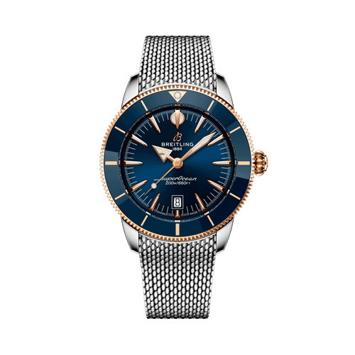 Breitling Superocean Heritage B31 Automatic 44 watch, elegant wristwatch with blue dial, gold accents, and stainless steel mesh strap.