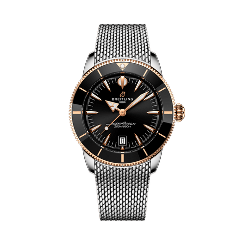 Breitling Superocean Heritage B31 Automatic 42 watch, black dial with gold accents, stainless steel and rose gold bezel, mesh bracelet, date display at 6 o'clock, water resistant to 200 meters.