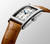 Longines DolceVita, luxury men's rectangular wristwatch with silver dial, blue hands, date display, and tan leather strap.