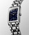 Longines DolceVita watch, elegant silver stainless steel rectangular watch with a starry blue dial and subdial, featuring a polished bracelet and crown detail.