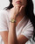 Longines Flagship watch, women's wristwatch with gold dial and two-tone bracelet on woman's wrist.