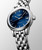 Longines Flagship watch, stainless steel wristwatch with a blue dial, date display, and automatic movement.