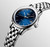 Longines Flagship watch, luxury stainless steel wristwatch with blue dial, automatic movement, date display, and polished bracelet.