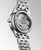 LONGINES FLAGSHIP watch, close-up view of the transparent case back showing the automatic movement and intricate inner mechanism.