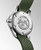 Longines HydroConquest watch, stainless steel case back with embossed Longines logo and winged hourglass emblem, green silicone strap with engraved details.