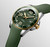 Longines HydroConquest, green dial and strap dive watch with gold bezel and crown, date display, automatic movement, water-resistant up to 300 meters.