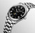 Longines The Longines Master Collection watch, stainless steel case and bracelet with black textured dial and Roman numerals, featuring moon phase, automatic movement, and date complication.