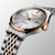 Longines Record Watch, luxury men's automatic chronometer with silver dial, rose gold bezel, and two-tone stainless steel bracelet.