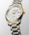 Longines The Longines Master Collection [L2.793.5.97.7], luxury men's automatic wristwatch with two-tone stainless steel and gold bracelet, white textured dial, date display, and diamond hour markers.