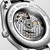 Longines The Longines Master Collection watch, showcasing the detailed Swiss-made automatic movement through a transparent case back with engraved branding and serial number.