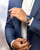LONGINES THE LONGINES MASTER COLLECTION [L2.773.4.92.6], men's stainless steel watch with blue dial on a man's wrist, worn with a blue suit and white shirt.