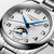 Longines The Longines Master Collection [L2.409.4.78.6], luxury men's wristwatch with silver textured dial, blue hands, moon phase and date subdial, stainless steel bracelet, and automatic movement.