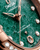 OMEGA Constellation co-axial Master Chronometer 29 mm watch, close-up of the green marble dial with diamond hour markers and date window.