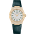 Omega Constellation Co-Axial Master Chronometer 29 mm watch, luxurious gold case adorned with diamonds, silver and diamond-paved dial, green hour markers, and dark leather strap.