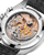 Omega Speedmaster Calibre 321 Chronograph 42 mm watch, intricate skeleton design showcasing the mechanical movement with gold and silver gears, black strap, and polished stainless steel case.