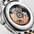LONGINES Elegance Lyre [L4.374.3.07.7], close-up view of the automatic watch's transparent case back showing its intricate mechanical movement and branding.