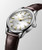 LONGINES Conquest Heritage [L1.649.4.72.0], luxury wristwatch with a white dial, gold-tone hands and markers, stainless steel case, and brown leather strap.