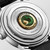LONGINES Conquest Heritage [L1.649.4.52.0], close-up view of the case back featuring the brand's logo and a green serpent emblem surrounded by inscriptions.