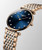 LONGINES Elegance La Grande Classique [L4.512.1.98.7], luxurious wristwatch with a blue sunburst dial, diamond hour markers, and a two-tone stainless steel and rose gold bracelet.