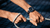 OMEGA Speedmaster X-33 Marstimer, wrist watch on a person's wrist as they pull a rope.