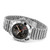 BREITLING Chronomat GMT 40 [A323982B1B1A1], a luxurious silver stainless steel wristwatch with a black dial, gold accents, and a date display, featuring a ripple-style bracelet and rotating bezel.