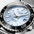 LONGINES Longines HydroConquest [L3.779.4.99.6], close-up image of the light blue dial, stainless steel case, and black unidirectional rotating bezel with white markings.