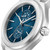 CERRUTI 1881 WATCH, a stylish men's wristwatch featuring a blue textured dial with silver-tone hands and markers, dual subdials displaying day of the week and seconds, stainless steel case and band, and a screw-down crown with 'GR' logo.