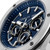 CERRUTI 1881 WATCH, close-up of the luxury men's chronograph watch with a blue dial, silver accents, and multiple subdials.