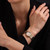 CERRUTI 1881 WATCH [CIWLG0072911], stylish women's wristwatch with a two-tone metal strap and a round bezel encrusted with crystals, featuring a pink face with hour markers and gold hands.