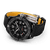 Breitling Avenger Automatic 42 Night Mission wristwatch, black dial with chronograph features, luminous hands, and a black textured strap with yellow interior.