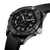 Breitling Avenger Automatic 42 Night Mission, black camo dial with luminous hands and markers, black unidirectional rotating bezel with engraved numerals, and black textured rubber strap.