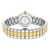 SAINT HONORE ORSAY watch, back view showing the stainless steel and gold-tone bracelet with a round case and engraved details on the back.