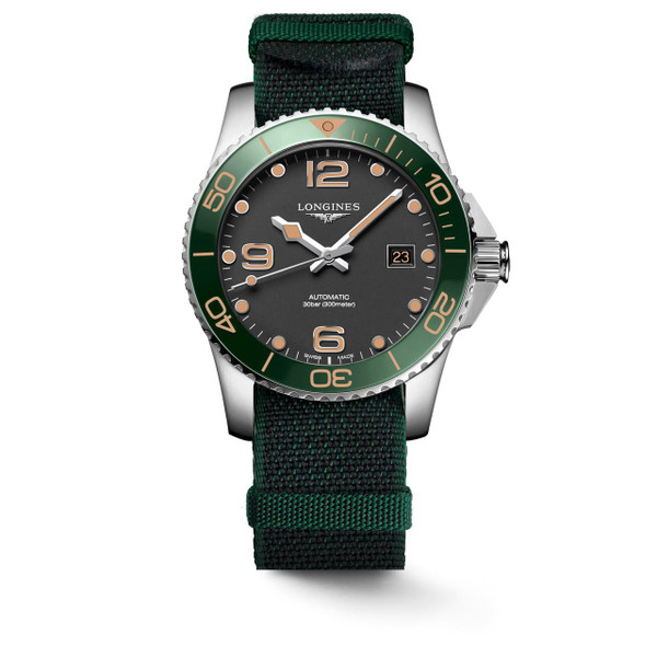 LONGINES HYDROCONQUEST [L3.781.4.05.2], men's professional diver's watch with black dial, luminous hands and markers, green unidirectional rotating bezel, date display, automatic movement, water-resistant up to 300 meters, and a green and black fabric strap.