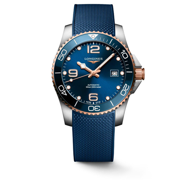 Longines HydroConquest watch, stainless steel case with rose gold accents, blue dial, blue rubber strap, automatic movement, and water resistance up to 300 meters.