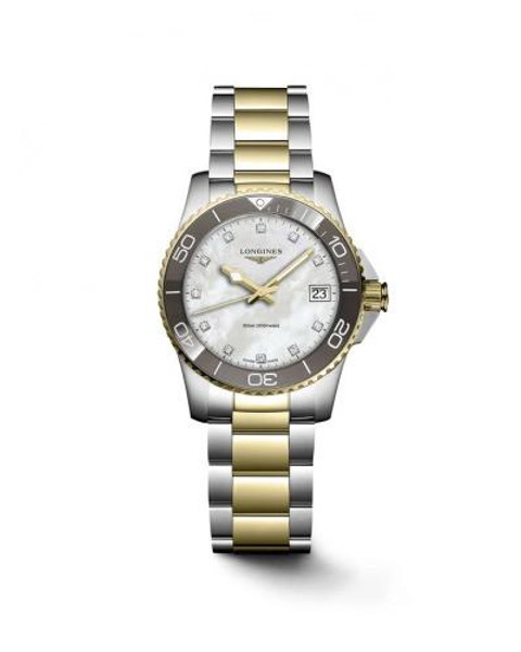 LONGINES HYDROCONQUEST watch, luxury two-tone stainless steel and gold diver's watch with white dial, date display, and unidirectional rotating bezel.