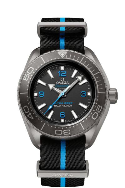 OMEGA Seamaster Planet Ocean 6000M co-axial Master Chronometer 45.5 mm watch, stainless steel case with black dial, blue accents, and a black fabric strap with blue stripe.