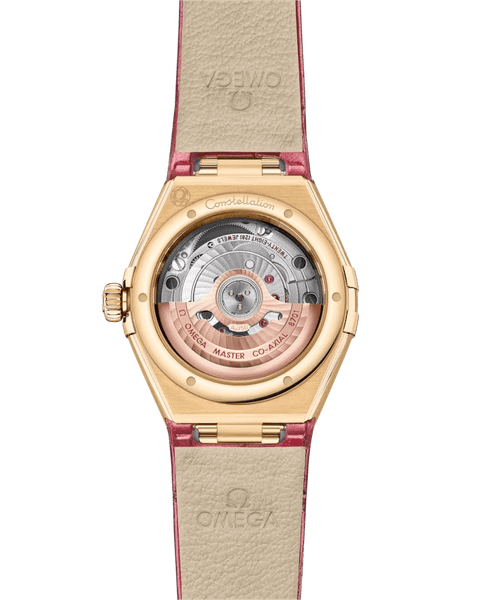 OMEGA Constellation co-axial Master Chronometer 29 mm, watch back showing intricate mechanical movement and gold case with pink leather strap.