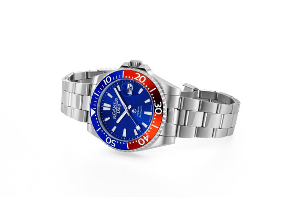 ROAMER WATCH, stainless steel wristwatch with a blue dial and a red-blue bezel.