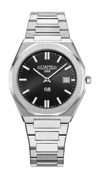 Roamer Watch, a stainless steel wristwatch with a black dial, silver hour markers, date display at 3 o'clock, and a matching stainless steel bracelet.