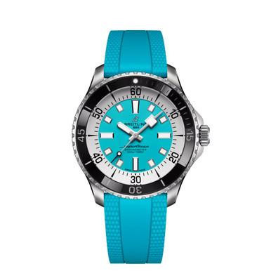 BREITLING Superocean Automatic 44, watch with a vibrant turquoise dial and matching rubber strap, featuring a black and silver bezel and luminous hands and markers.