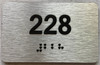 apartment number 228 sign