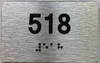 apartment number 518 sign