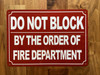 DO NOT BLOCK BY ORDER OF FIRE MARSHAL SAFETY SIGN