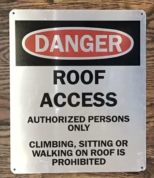 ROOF ACCESS AUTHORIZED PERSONS ONLY CLIMBING, SITTING OR WALKING ON ROOF IS PROHIBITED