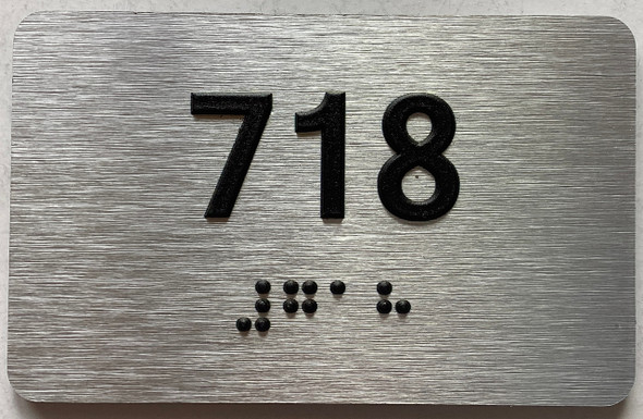apartment number 718 sign