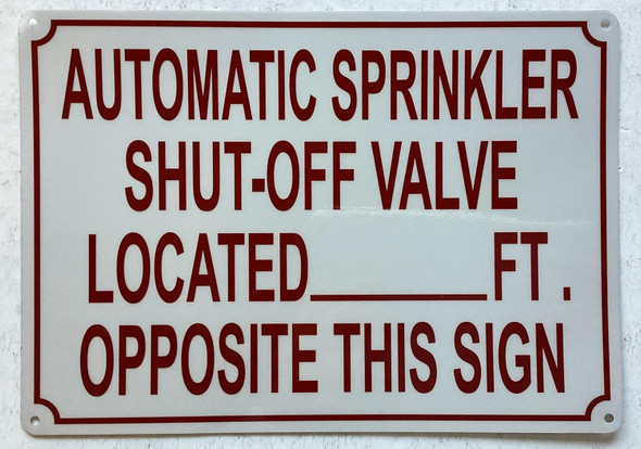 AUTOMATIC SPRINKLER SHUT OFF VALVE LOCATED FEET OPPOSITE THIS SIGN SIGN