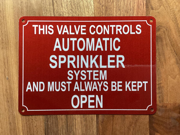 NYC THIS VALVE CONTROLS AUTOMATIC SPRINKLER SYSTEM AND MUST ALWAYS BE KEPT OPEN SIGN